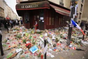 outside the Le Carillon restaurant, one of the scenes of last friday's terror attacks, on November 16, 2015 in Paris, France. Countries across Europe joined France, currently observing three days of national mourning, in a one minute-silence today in an expression of solidarity with the victims of the terrorist attacks, which left at least 129 people dead and hundreds more injured.